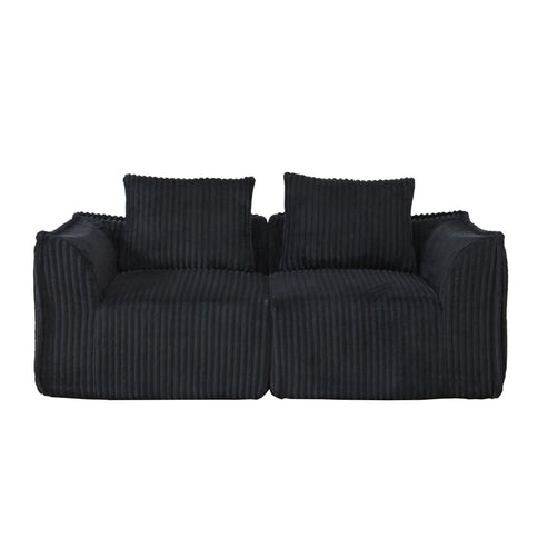 Minimalist Sofa With Curved Lines And Horn Shaped Throw Pillows