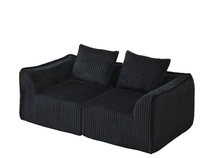 Minimalist Sofa With Curved Lines And Horn Shaped Throw Pillows