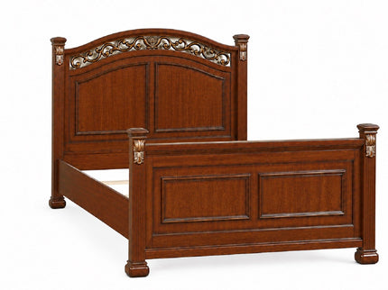 Bed With Ornate Carvings And Curved Headboard