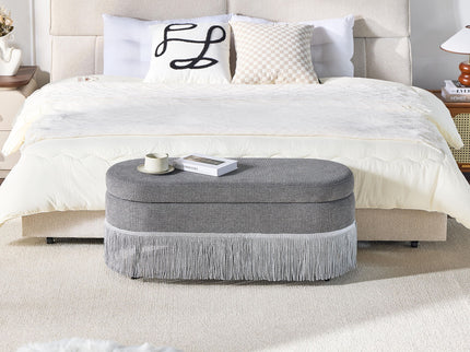 Oval Upholstered Storage Ottoman With Fringe Trim & Lift Top Lid