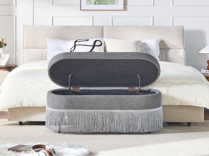 Oval Upholstered Storage Ottoman With Fringe Trim & Lift Top Lid