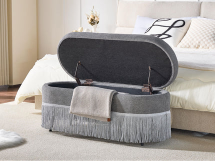 Oval Upholstered Storage Ottoman With Fringe Trim & Lift Top Lid